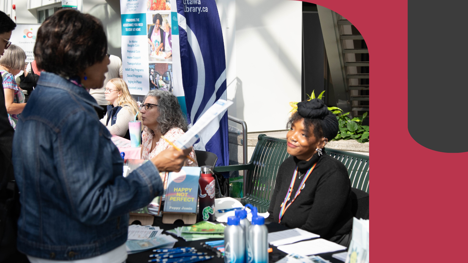 Newcomers interacting with service agents during Welcoming Ottawa Week.